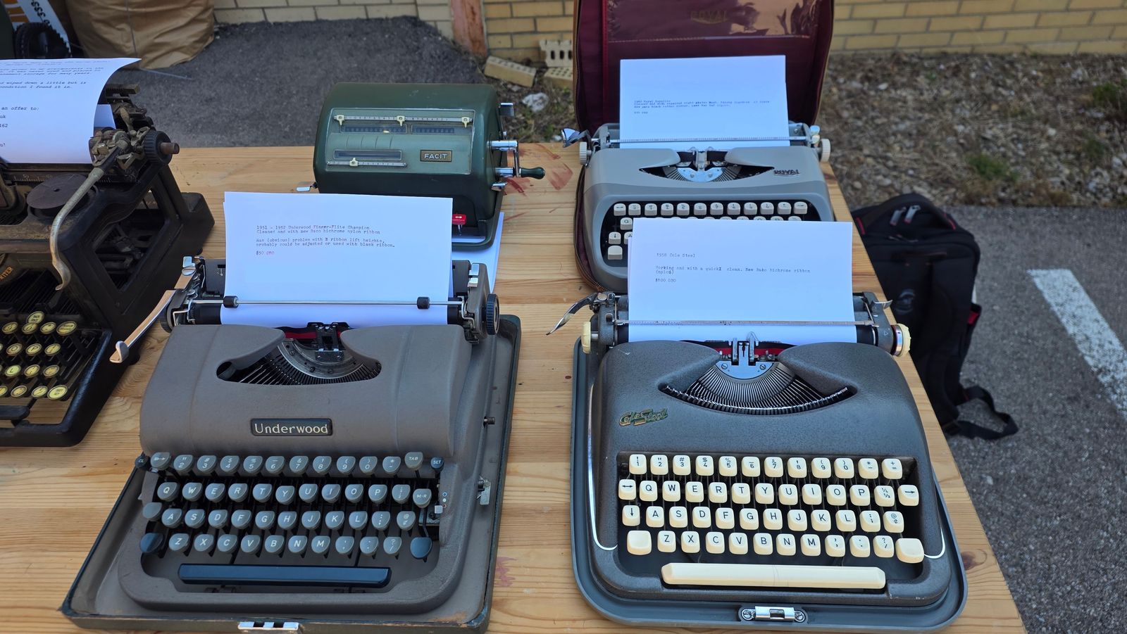 Four machines on a table. Clockwise from top left: Facit NTK calculator, Royalite, Cole Steel, Underwood Finger Flite Champion